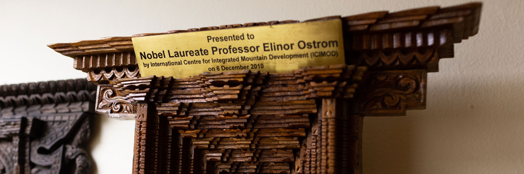 A beautifully carved wall temple, in tribute to Elinor Ostrom. 
