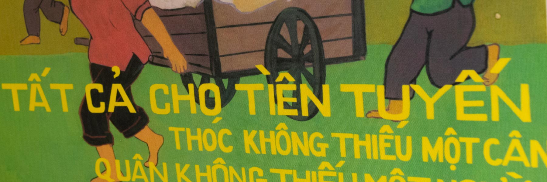 A close-up of a brightly colored Asian poster hanging in the Ostrom Workshop. 