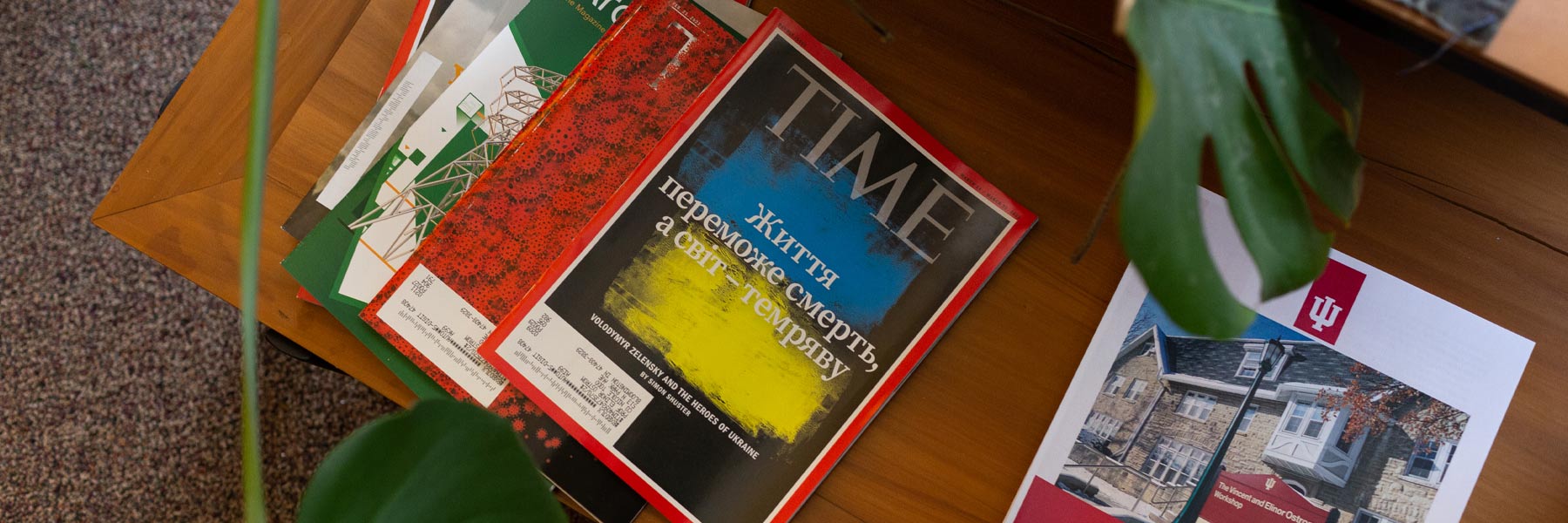 A copy of Time magazine, with a headline about the 2022 Russian invasion of Ukraine, sits on a coffee table at the Ostrom Workshop. 